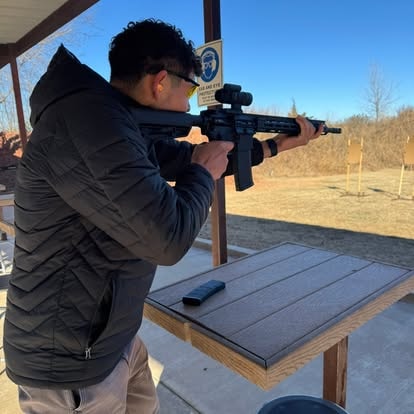 Student shooting AR-15 carbine at the range during Carbine I class