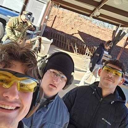 Students geared up with eye and ear protection at the range